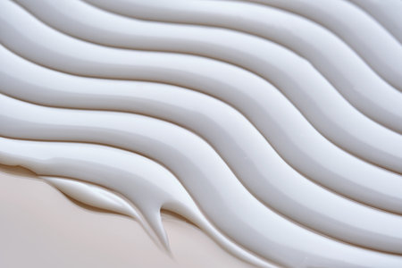 Beautiful waves of cream close-up. Beauty background.の写真素材