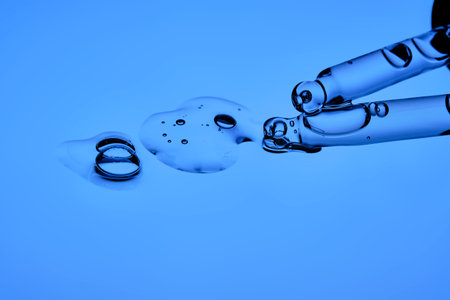 The texture of the serum and two droppers on a blue background.の写真素材