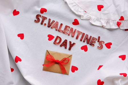 Festive St. Valentines Day background of a white cotton blouse with hearts.の写真素材