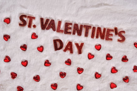 Festive St. Valentines Day background on a white plush background with hearts.の写真素材