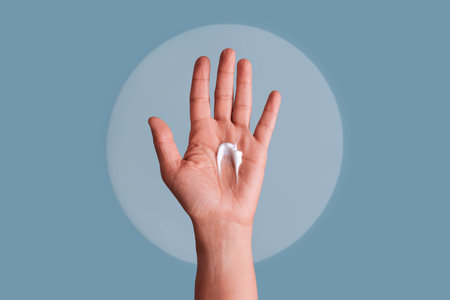 Hand palm holding white cream for skincareの写真素材
