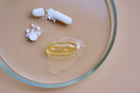 Pills medicine capsules and supplements in petri dishの写真素材