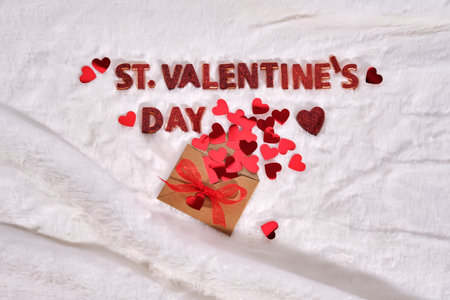 Festive St. Valentines Day background on a white plush background with hearts.の写真素材