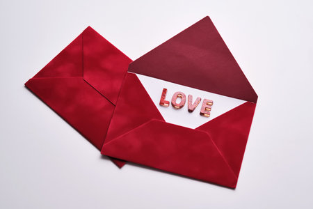Red envelope revealing love message for valentines dayの写真素材