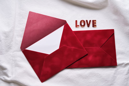 Red love letters with envelope on white background