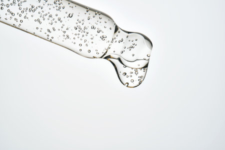 Cosmetic pipette dropping serum with air bubblesの写真素材