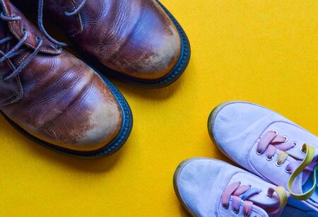 Shoes of a father and a girl together. Ideal to celebrate father's day