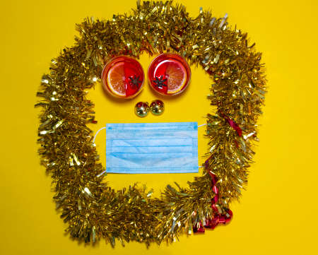 Overhead shot of a one-sided composition with glasses of mulled wine, Christmas balls, and a...