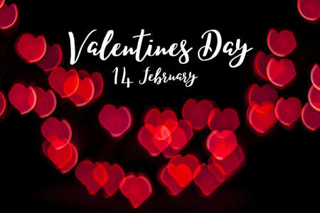 Valentines Day on Red Heart Bokeh on black background. Valentine conceptの写真素材
