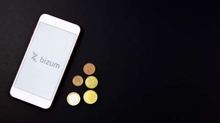 Spain. 02, 03, 2021. Overhead shot of a smartphone with the Bizum application home screen. Instant payment concept with smartphoneのeditorial素材