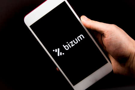 Spain. 02, 03, 2021. Overhead shot of a smartphone with the Bizum application home screen. Instant payment concept with smartphoneのeditorial素材