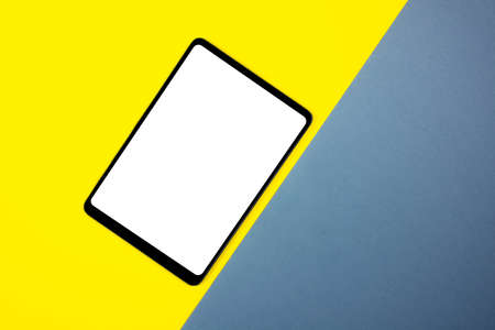 Mock up of a tablet on different colored backgrounds.