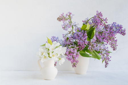 White flowers in a vase on a light background. Interior decorの写真素材
