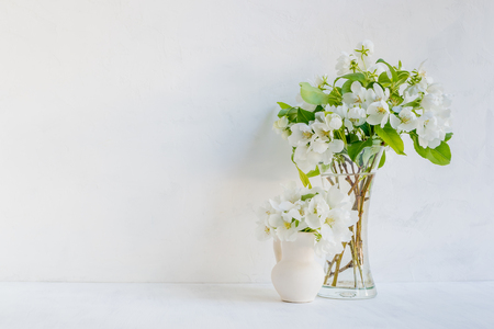 White flowers in a vase on a light background. Interior decorの写真素材