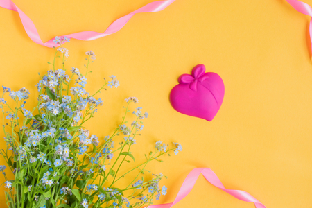 Blue flowers on a yellow background empty space for your text, top viewの写真素材
