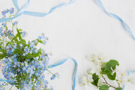 Blue and white flowers on a light background empty space for your text, top viewの写真素材