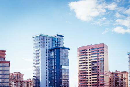 Modern high-rise buildings on a blue skyの写真素材