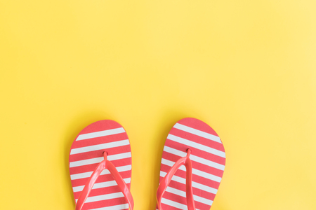 Flip flops on a yellow background. Top view, flat layの写真素材