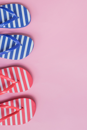 Flip flops on a pink background. Top view, flat layの写真素材
