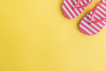 Flip flops on a yellow background. Top view, flat layの写真素材