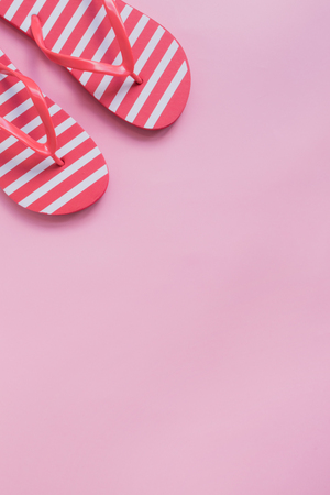 Flip flops on a pink background. Top view, flat layの写真素材