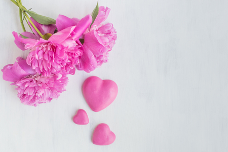 Pink peonies on a light background empty space for your text, flat layの写真素材
