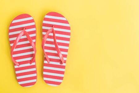 Flip flops on a yellow background. Top view, flat layの写真素材