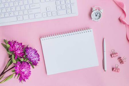Mockup notebook with pink flowers on pink backgroundの写真素材