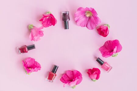 Flat lay pattern with pink flowers and female cosmetics. Beauty blog conceptの写真素材