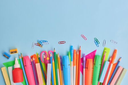 School supplies frame on a blue backgroundの写真素材