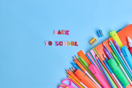 School supplies frame on a blue backgroundの写真素材