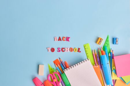 School supplies frame on a blue backgroundの写真素材