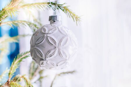 Holiday border with hanging gold ball on a light backgroundの写真素材