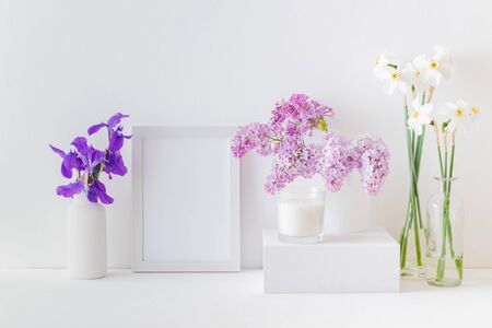 Home interior with decor elements. White frame, white daffodils in a vase, interior decorationの写真素材
