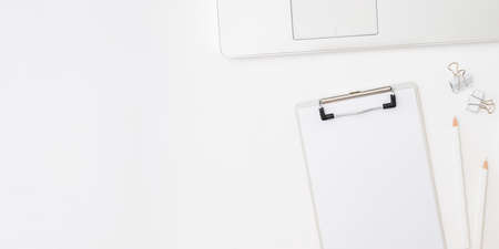 Mockup clipboard, laptop a cup of coffee on a white background