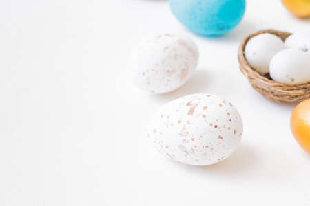 Easter composition with easter eggs on a light backgroundの写真素材