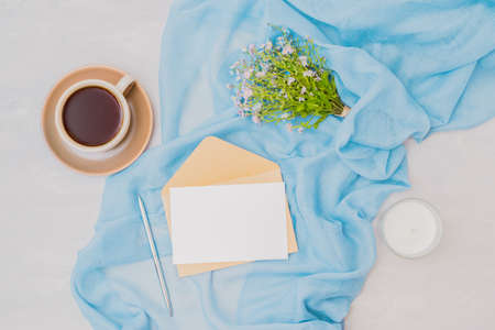 Workspace wedding invitation with a scarf, blue flowers on a light backgroundの写真素材