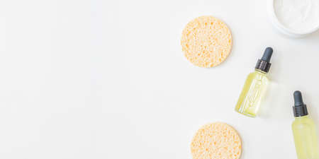 Flat lay composition with cosmetics on a light background