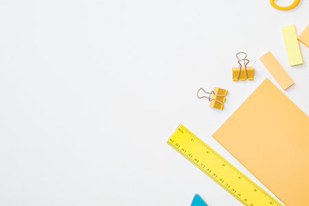 Flat lay frame with school and office supplies on a white backgroundの写真素材