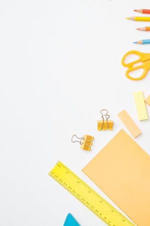 Flat lay frame with school and office supplies on a white backgroundの写真素材