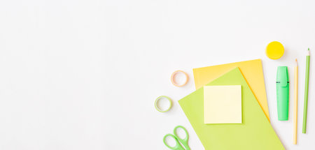 Flat lay frame with school and office supplies on a white backgroundの写真素材