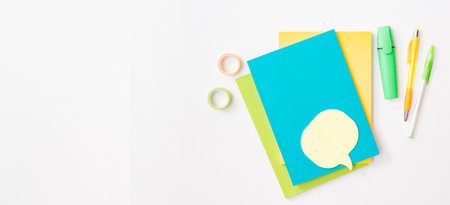Flat lay frame with school and office supplies on a white backgroundの写真素材