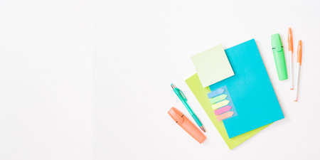 Flat lay frame with school and office supplies on a white backgroundの写真素材