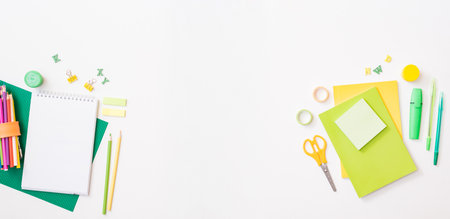 Flat lay frame with school and office supplies on a white backgroundの写真素材
