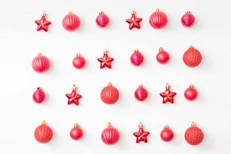 Flat lay pattern with christmas balls and decorations on a white backgroundの写真素材