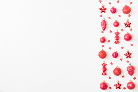 Flat lay pattern with christmas balls and decorations on a white backgroundの写真素材