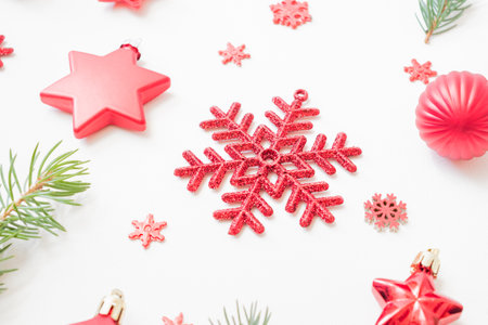Holiday pattern with fir branches, christmas balls and snowflake on a white backgroundの写真素材