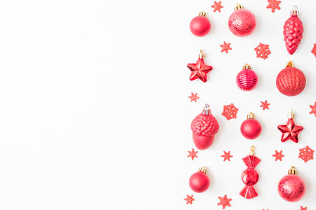 Flat lay pattern with christmas balls and decorations on a white backgroundの写真素材