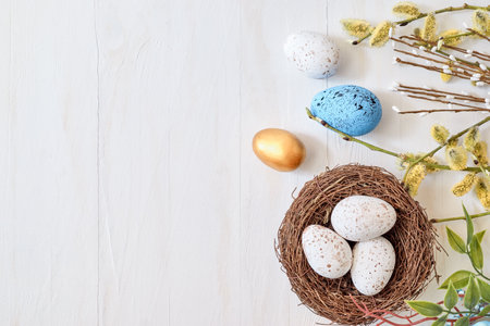 Willow branches and decorations, easter eggs on a light background. Happy easter flat lay concept
