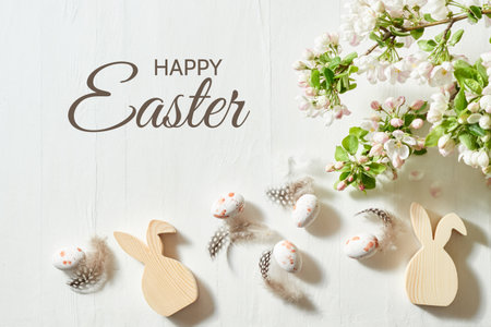 Holiday composition with spring flowers and easter eggs on a light background. Happy easter flat lay conceptの写真素材